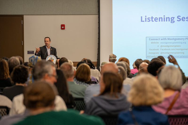 CP Friedson speaking to a large audience at the Attainable Housing Strategies listening session in Silver Spring.