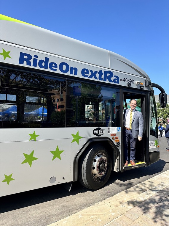 Councilmember Glass on a RideOn extRa bus along the new Lime route