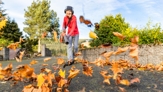 A person using a leaf blower