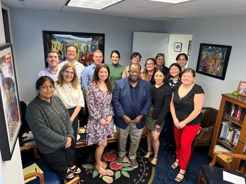 Rep. Raskin and Friedson staff take a team photo together in an office.