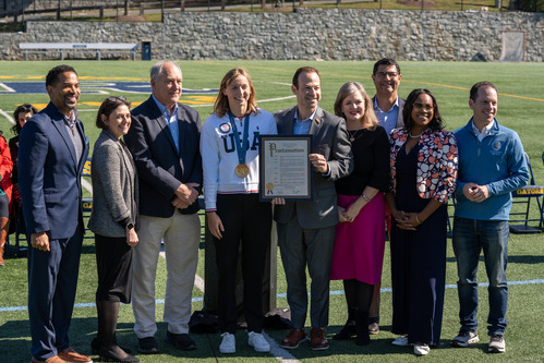 CVP Stewart with the Council and CE Elrich presenting a proclamation to Katie Ledecky