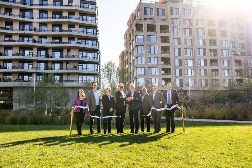 Ribbon cutting in front of new Strathmore Square development.