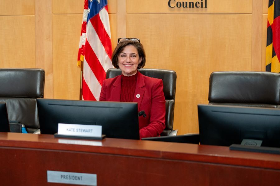 Kate Stewart sitting at the Council dais in the president's seat.