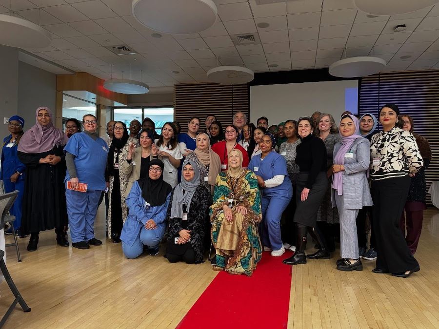 CNA graduates, AMSS members and County leaders pose for a group photo.