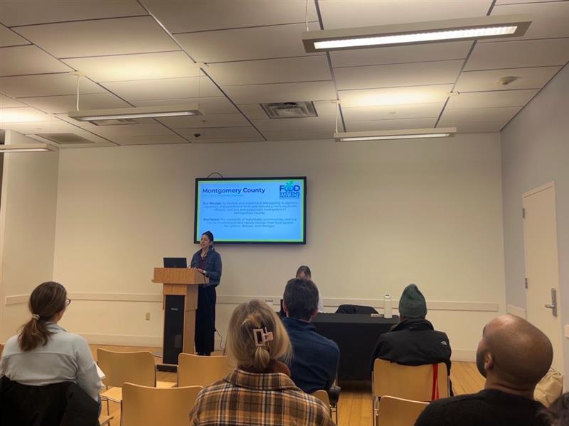 Picture of Catherine Nardi standing at a podium presenting at the Future Harvest Conference Picture of Catherine Nardi standing at a podium presenting at the Future Harvest Conference
