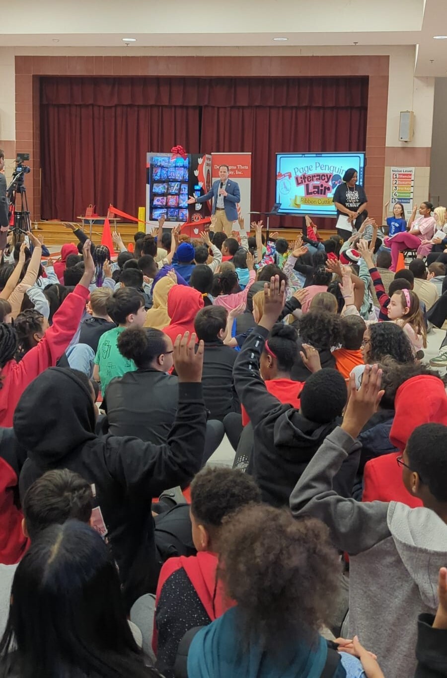 Councilmember Glass speaks at the unveiling of the new book machine at William Tyler Page Elementary School.