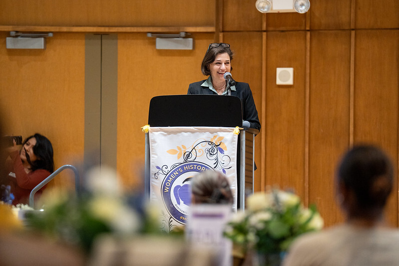 Council President Stewart speaks on stage at the annual Women’s History Month event.