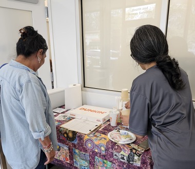 Long Branch seniors sign in for the Coffee Chat at TESS
