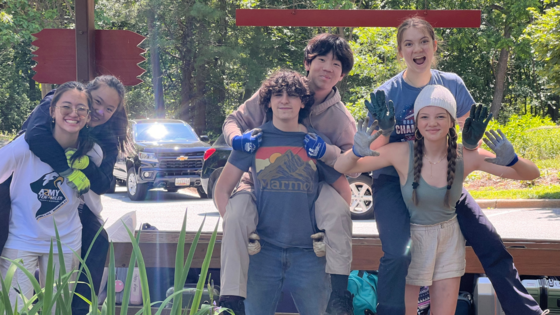 photo of 6 students with three students giving a piggyback ride to three other students