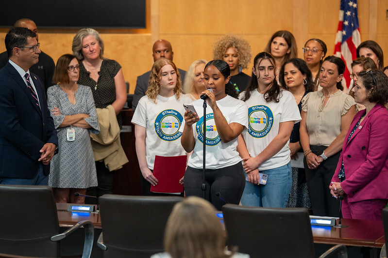 A BTheOne Youth Ambassador speaks at the Council’s Mental Health Awareness Month commemoration.