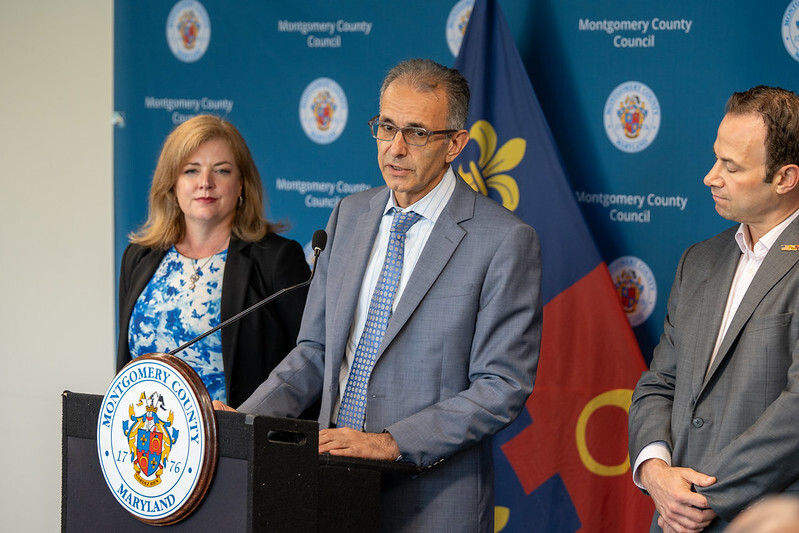 photos of county officials at news conference 