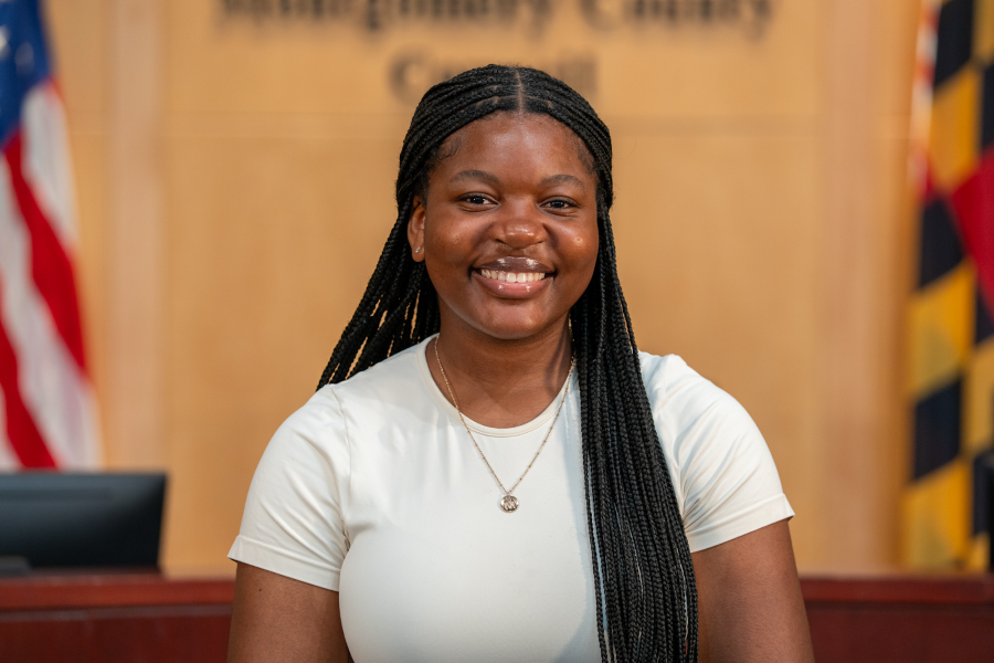 Headshot of Manone Djeukam in Council hearing room.