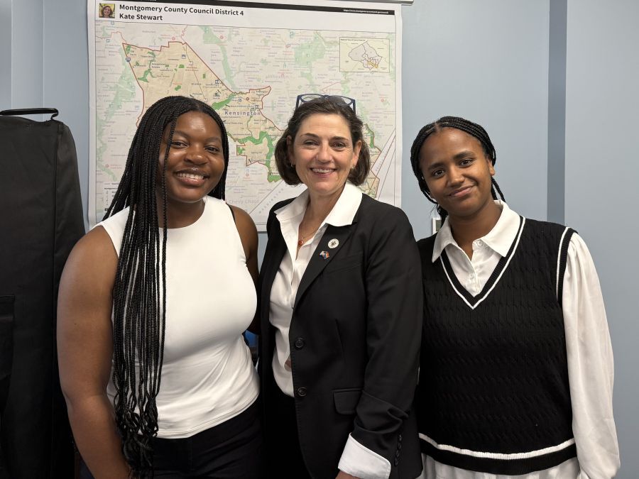 Manone Djeukam, Council President Stewart and Meron Aga.