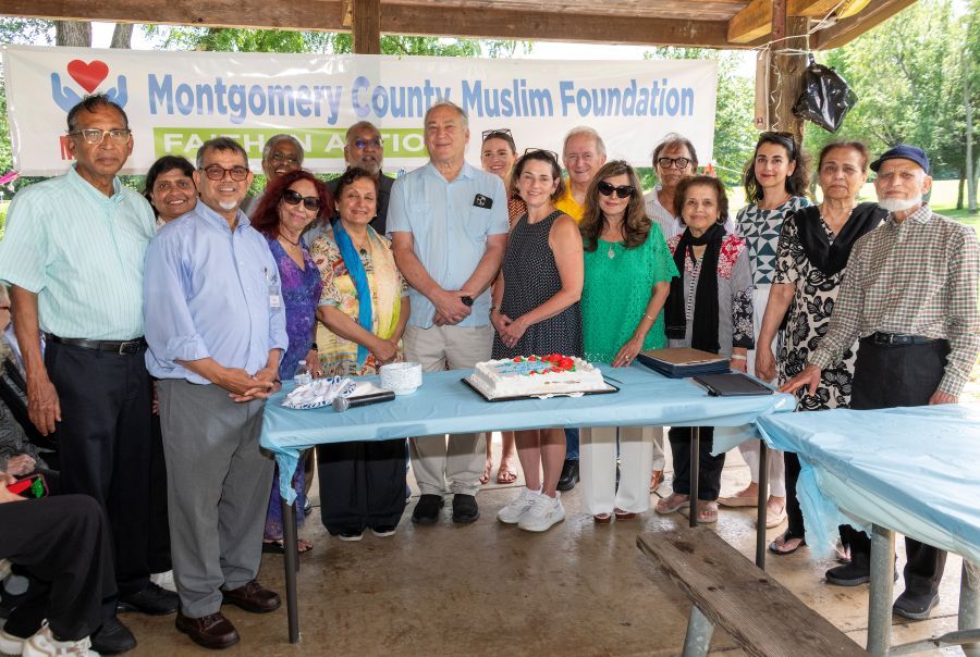 Group photo with County Executive Elrich, CP Stewart, and community members at the MCMF Senior Picnic.