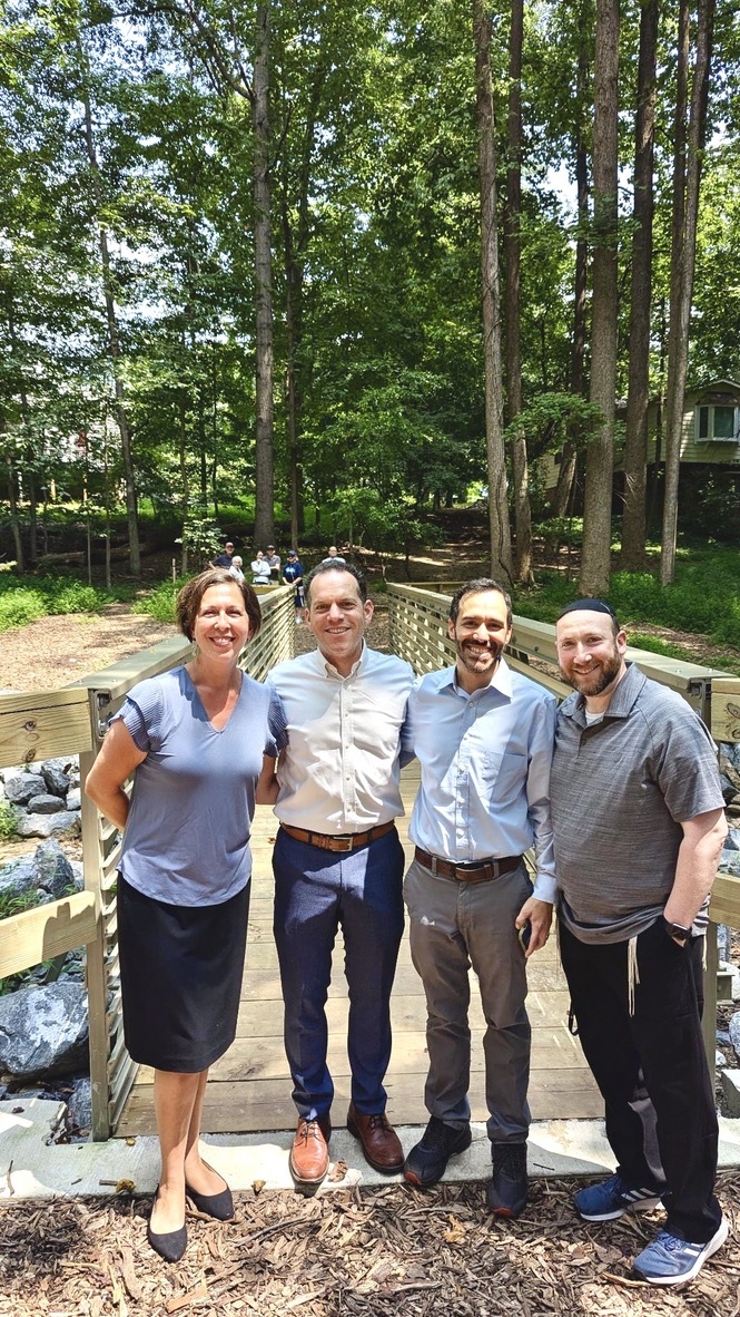Councilmember Glass celebrates the new pedestrian bridge with Kemp Mill residents.