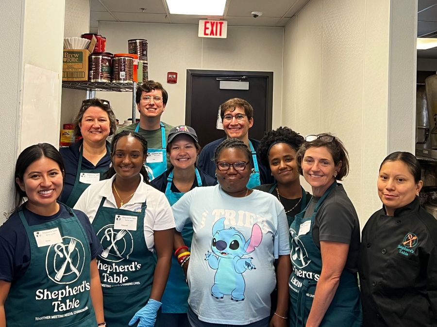 Team Stewart and volunteers wearing Shepherd’s Table aprons