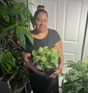 Diana Preston holding potted plants