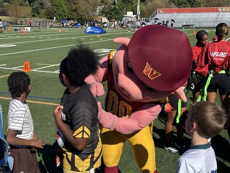 Major Tuddy signing kid's jersey