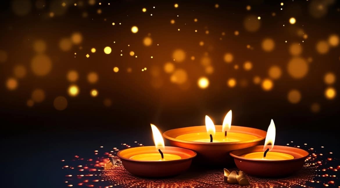 Lit candles glowing in the dark.