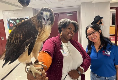 Navigators Trica Young and Paola Lopez with an Eagle from the Outdoor Education program. 