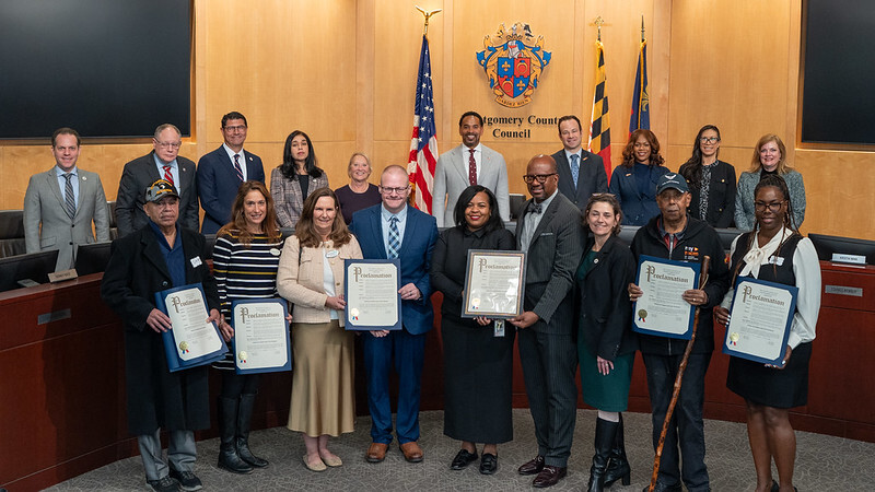 The council presenting a proclamation for Operation Green Light for Veterans