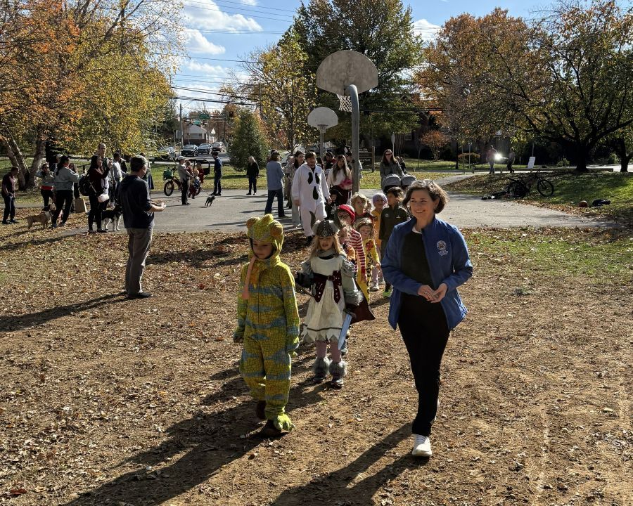 Council President Stewart leads the Halloween costume parade.