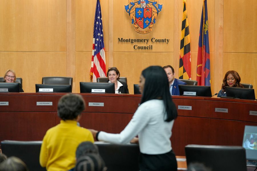 Student asks a question in the Council chamber at the Youth Town Hall.