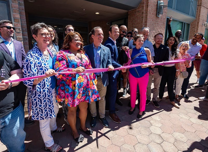 County leaders cut a pink ribbon at the opening of the MoCo Pride Center.