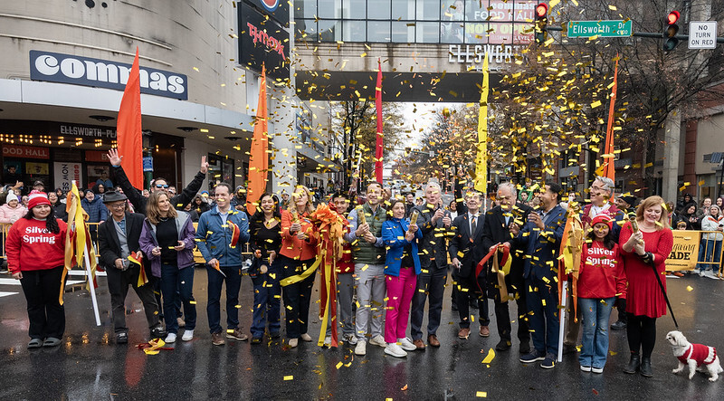 Officials launch confetti at the Montgomery County Thanksgiving Parade ribbon-cutting ceremony in Silver Spring.
