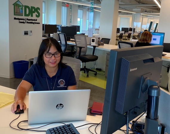 front desk dps lobby with dps employee working on a computer