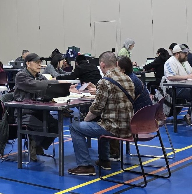 VITA volunteers assisting clients.