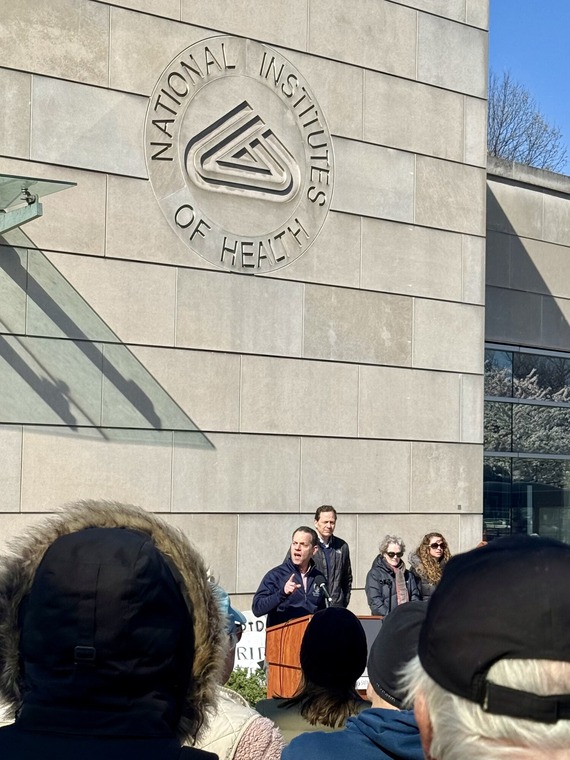 Councilmember Evan Glass addresses No Kings protestors at the National Institutes of Health