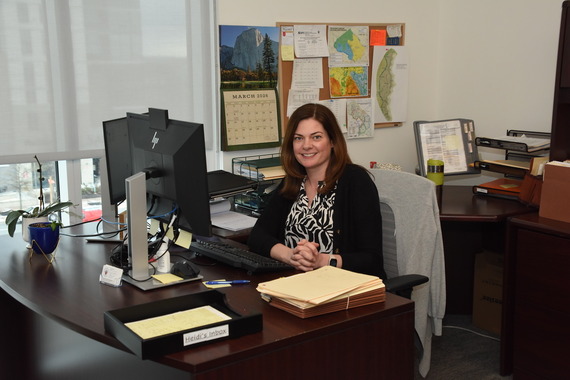 photo of Well and Septic Manager at her desk at the Department of Permitting Services. 