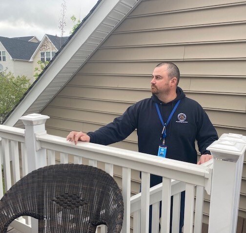 photo of residential inspector checking a deck