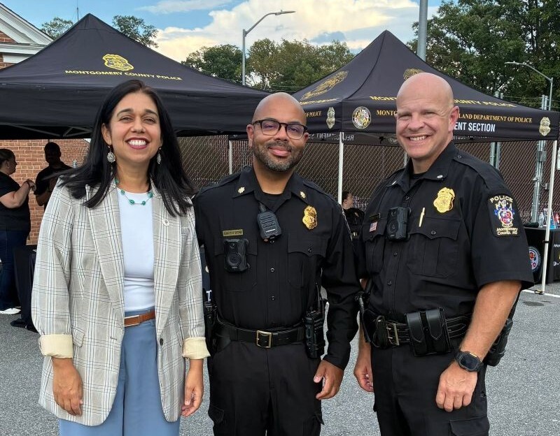 Council President Fani-González smiles with MCPD Commander Smith and Assistant Chief Francke.