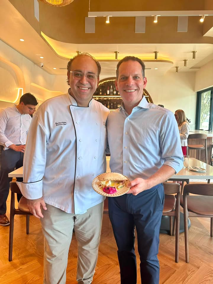 Councilmember Glass next to Chef Rachid Eido
