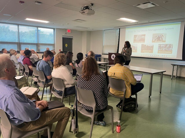 Residents attend a town hall about waste disposal. 