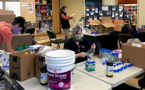 Living CLassroom Foundation members working on assembling take home kits