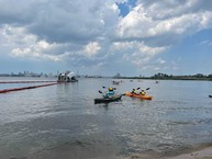 Paddlers at the Latino Conservation event at Masonville Cove