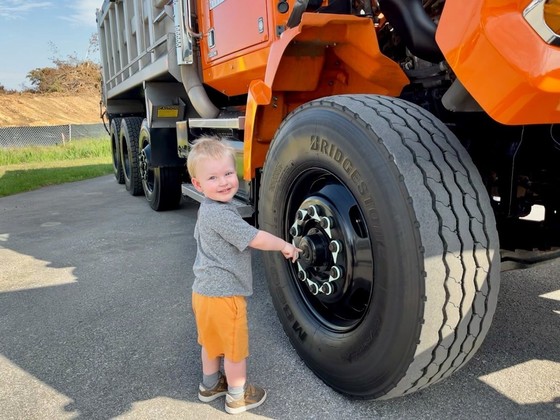 Young child participating in 'Touch a Truck" event at Cox Creek Open House