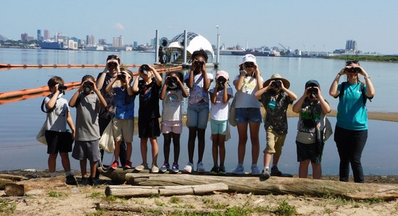 Youth Birding Week Attendees take a photo with Captain Trashwheel