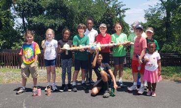 Youth Birding Week Attendees holding their handmade cereal box eagle 