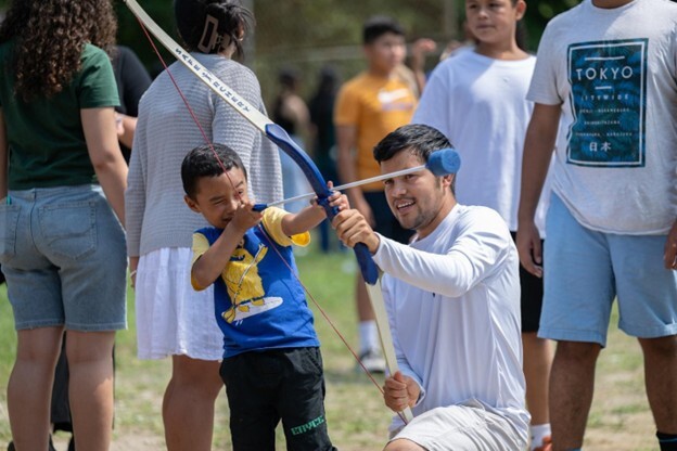 Child learns archery