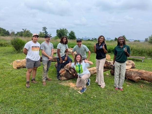 The 2025 MCL WildSTEM interns join Camp Small staff to celebrate the completion of the new nature playspace.
