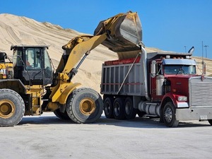 Salt being placed in large trucks