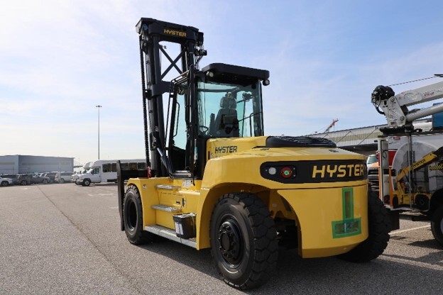 Yellow fork lift in parking lot