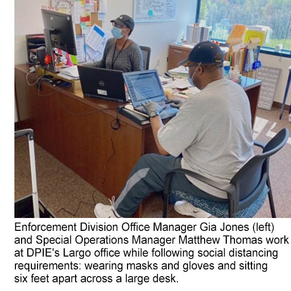 Enforcement employees weear masks, gloves and sit 6 feet apart while working