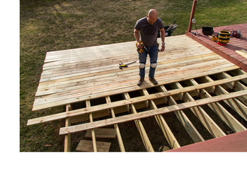 person building a deck