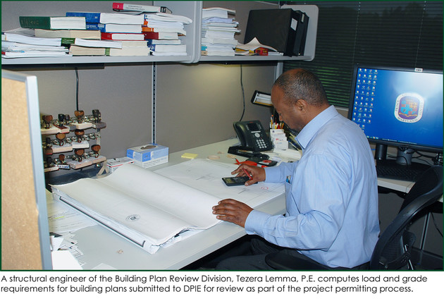 Structural engineer Tezera Lemma computes load and grade requirements during plan review