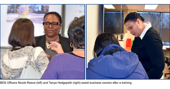 Nicole Reece and Tanya Hedgepeth assist business owners after a training presentation